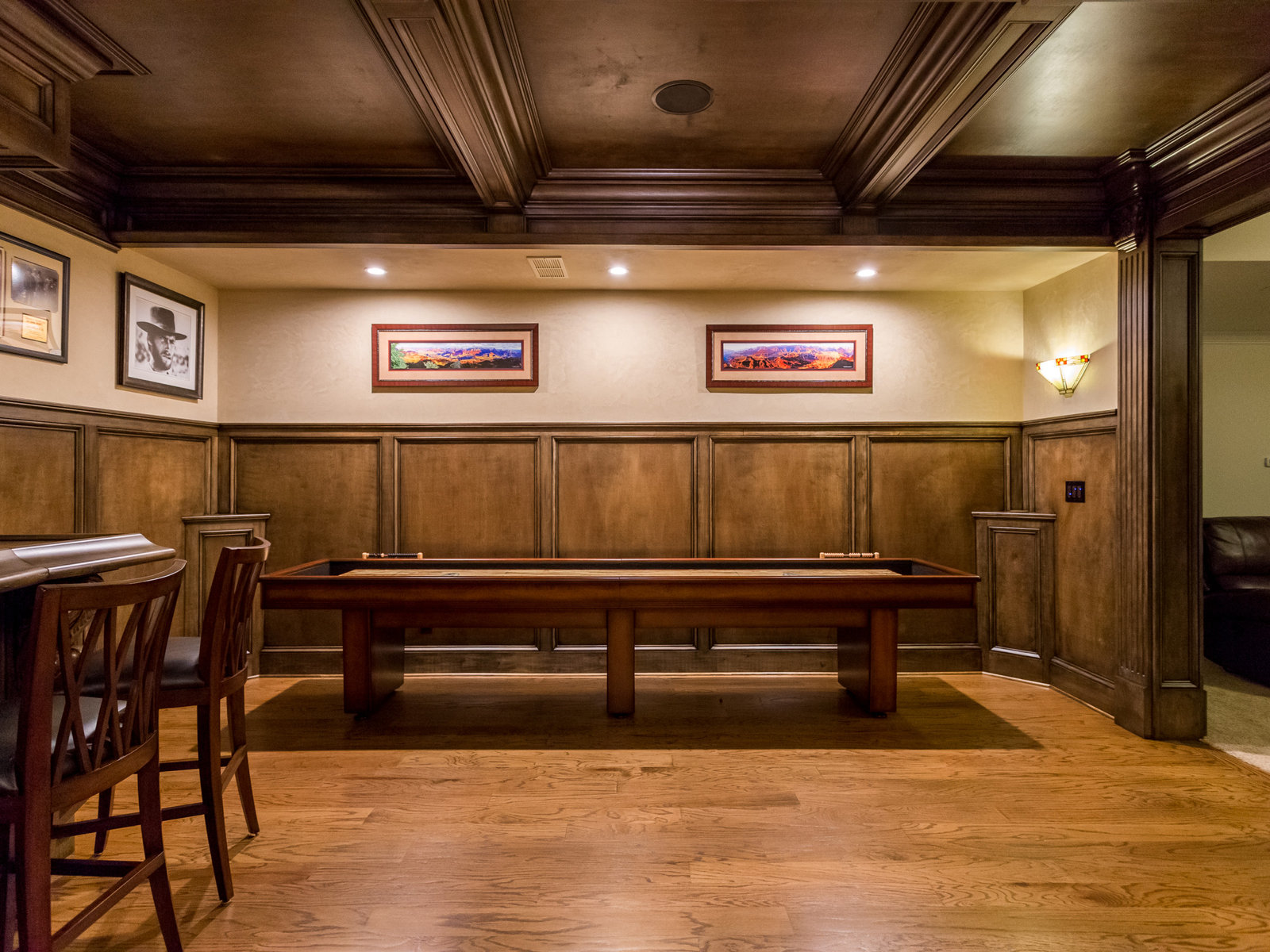 Marlow Irish pub style bar and wine cellar in Alpharetta, GA by All-Square Contracting — wood-panelled billiards room with bar seating